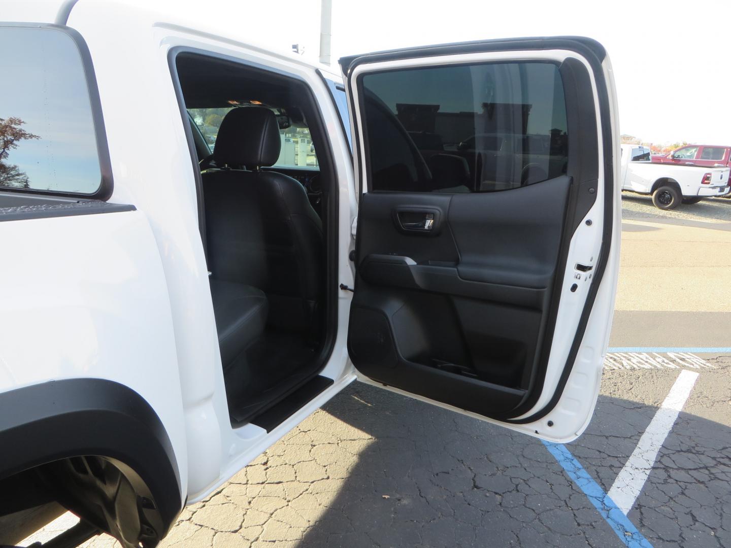 2019 White /black Toyota Tacoma TRD OFF-ROAD Double Cab (3TMAZ5CN4KM) with an 3.5L engine, automatic transmission, located at 2630 Grass Valley Highway, Auburn, CA, 95603, (530) 508-5100, 38.937893, -121.095482 - TRD Offroad 2WD sitting on Fox 2.5 remote reservoir DSC Coil-overs, Total Chaos upper control arms, Rigid Industries Dually side shooter leds, Fuel Rebel wheels, Nitto Ridge Grappler tires, and window tint. - Photo#47